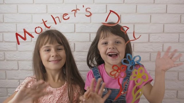 Mothers Day. Video Postcard. Happy little girls congratulate mom on Mother's Day.