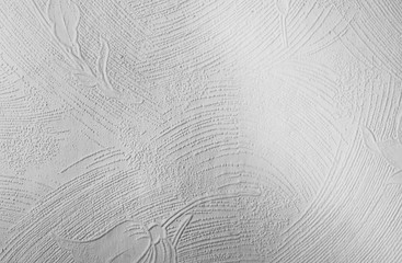 Plaster work on a wall showing the textured finish - In black and white