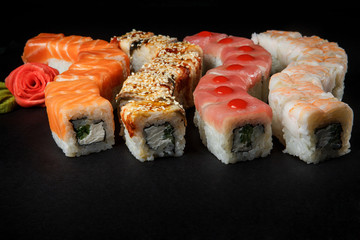 closeup assorted philadelphia sushi rolls with salmon, eel, tuna and tiger shrimp
