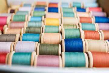 rolls of colorful threads, close-up and top view.