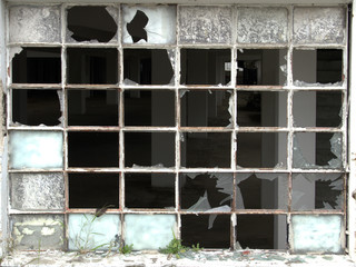 Old window with broken glass and rust everywhere, wallpaper straight shot