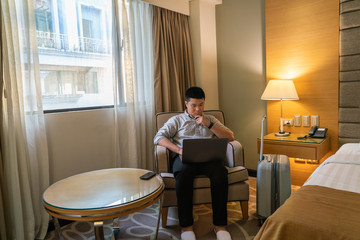 Young businessman working on laptop in the business trip