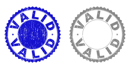 Grunge VALID stamp seals isolated on a white background. Rosette seals with grunge texture in blue and grey colors. Vector rubber stamp imprint of VALID label inside round rosette.
