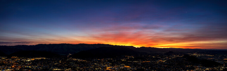 Sunrise panoramic view of City and Mountains