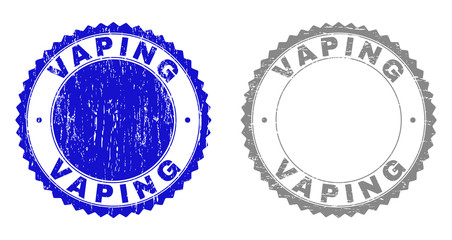 Grunge VAPING stamps isolated on a white background. Rosette seals with grunge texture in blue and gray colors. Vector rubber stamp imitation of VAPING tag inside round rosette.