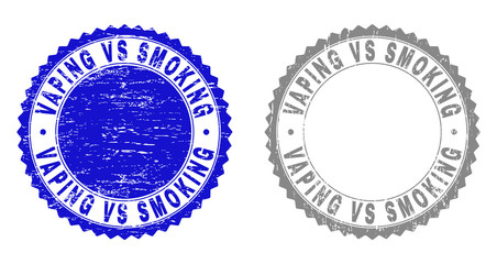 Obraz premium Grunge VAPING VS SMOKING stamp seals isolated on a white background. Rosette seals with grunge texture in blue and grey colors.
