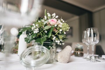 Table decoration with floral and pink pastel compositions