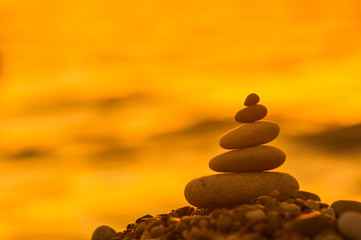 stack of zen stones on pebble beach