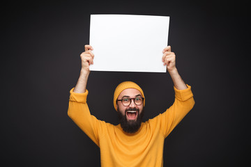 Cheerful male with blank poster