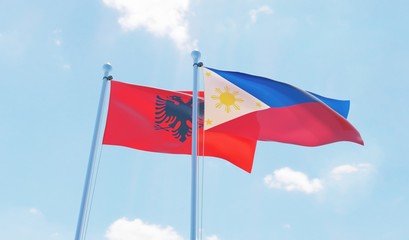 Philippines and Albania, two flags waving against blue sky. 3d image