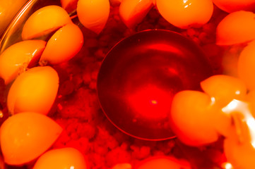 Fruit compote of apples in a saucepan with a ladle, close up