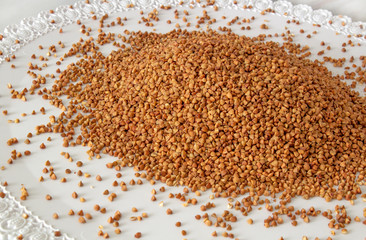 Buckwheat texture (lat. Fagopyrum esculentum). Source of vitamins, minerals and carbohydrates. Add to your diet diet, veganism. Background image, selective focus.