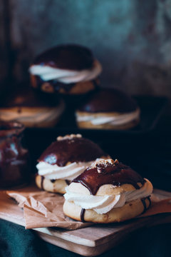 Cream filled bun with chocolate and chopped hazelnut