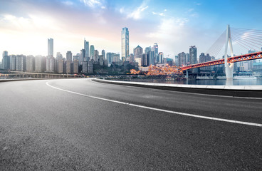 The expressway and the modern city skyline are in Chongqing, China.