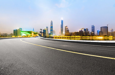 The expressway and the modern city skyline are in guangzhou, China.