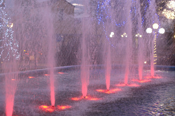 Water fountainat night  with red lighs