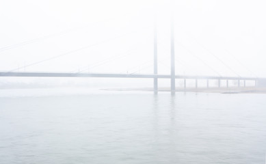 Bridge over the rhine during a foggy morning