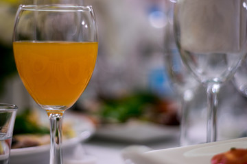 glass of juice on wedding table