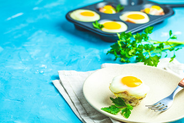 Portioned casserole from bacon  and eggs in Italian style