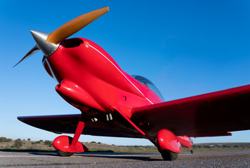 small red propeller plane
