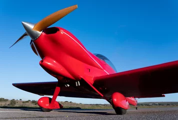 Foto op Canvas small red propeller plane © charlymorlock