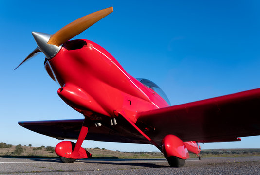 Small Red Propeller Plane