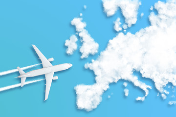 Fototapeta na wymiar Model airplane design miniature blue background fluffy clouds in the shape of continent Europe. The idea of tickets for the trip, traveling by plane, new discoveries, summer holidays