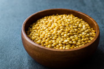 Yellow Lentils in Wooden Bowl.