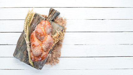 Braided bread with flour. Top view. Free space for your text.