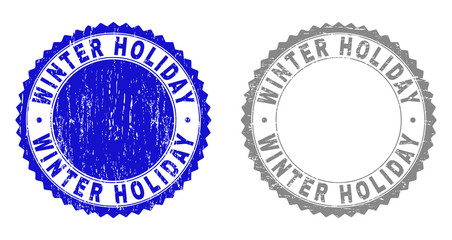 Grunge WINTER HOLIDAY stamp seals isolated on a white background. Rosette seals with grunge texture in blue and grey colors. Vector rubber stamp imitation of WINTER HOLIDAY title inside round rosette.