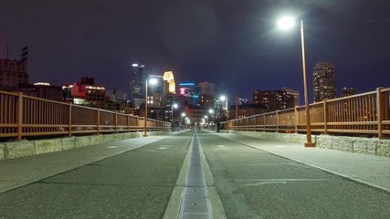 Time lapse of the Minneapolis Minnesota skyline seen from one of the many bridges crossing the Mississippi River.