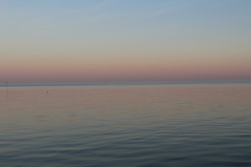 the North Sea, dipped in the evening sun in pastel colors