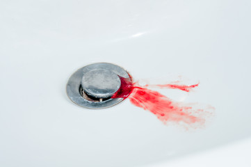 blood in the sink, concept problem with teeth or cuts on the arm