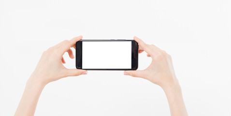 hand holding mobile phone gorizontal isolated on white background,empty blank screen