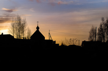 silhouette of a church on the sunset