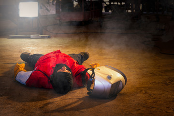 First aid training in the factory industrial. Welder accident in works and fainting in a factory...