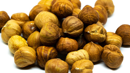 photo of peeled hazelnut isolated on white background