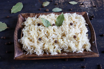 Pickled cabbage on a wooden tray