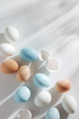 Natural Colored Eggs with morning sunlights. Stylish Compositions in pastel colors.  Easter concept.