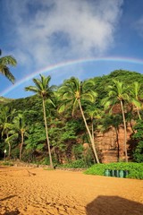 Fototapeta na wymiar Rainbow over Hanauma Bay beach in East Honolulu, Hawaii on a clear sunny day