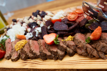 Ham appetizer and meat with strawberry and french mustard