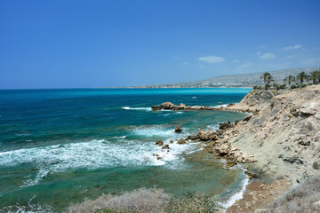 stony seashore of a wave in the bright sunny day on the island