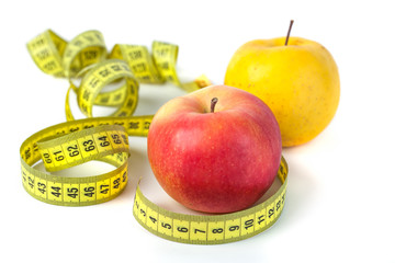 Apples with measure tape on white background, healthy diet