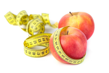 Apples with measure tape on white background, healthy diet