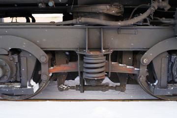 Obraz na płótnie Canvas Details of the wheel train in the winter, wheels of the locomotive, closeup