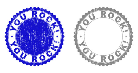 Grunge YOU ROCK! stamp seals isolated on a white background. Rosette seals with grunge texture in blue and grey colors. Vector rubber stamp imprint of YOU ROCK! title inside round rosette.