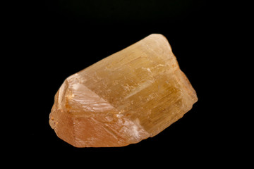 Macro mineral stone Spodumene on a black background