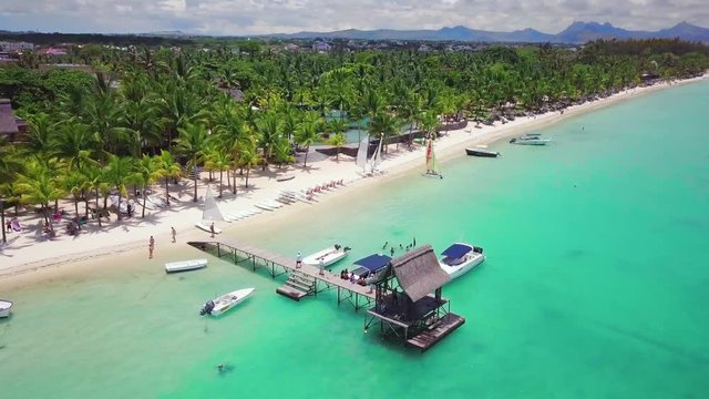 Aerial view of beautiful, exotic beach in Mauritus. Trou aux Biches, Mauritius island. Flight around the jetty.
