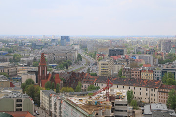 Naklejka premium Spring day in Wroclaw. View from the tower of the church of Saint Elizabeth to the west of the city. Visible buildings, blocks of flats, tenements, office buildings, Legnicka street. Wrocław, Breslau