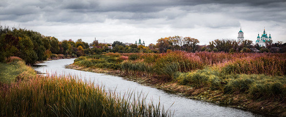 Autumn landscape with a river.